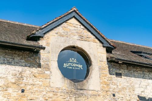 a window of a building with a sign on it at The Kings Arms Hotel in Melksham
