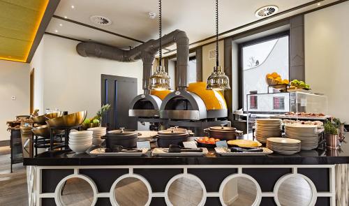 a kitchen with a lot of food on a counter at Pestana CR7 Gran Vía Madrid in Madrid