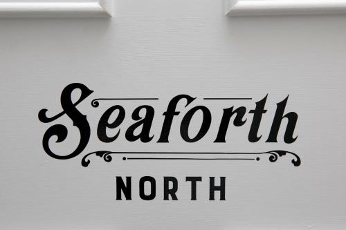 a white door with a sign that reads seaforth north at Lews Castle in Stornoway