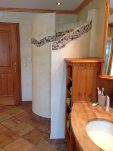 a bathroom with a sink and a column at Peterwirt in Bad Mitterndorf