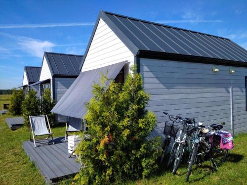 a couple of bikes parked next to a house at Strefa Kampinos in Brochów