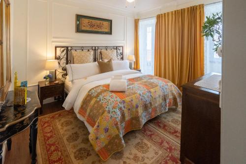 a bedroom with a bed with a candle on it at Quinta Pereirinha Farm - A Private 3 Bedroom Vacation Home, Close to Hiking w Ocean Views - Pico Island, Azores in São Roque do Pico