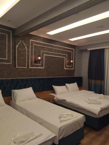 A bed or beds in a room at BoNaMi Hotel