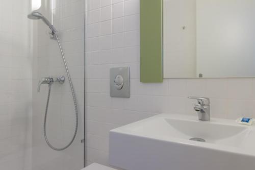 Et badeværelse på Ibis Budget Braga Centro