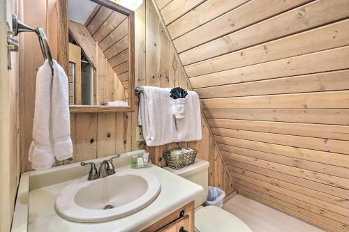 a bathroom with a sink and a toilet at Ski-InandSki-Out Red River Cabin with Mtn Views! in Red River