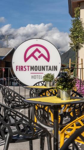 a first mountain hotel sign sitting on top of a table at first mountain Hotel Ötztal in Längenfeld