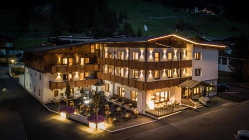 an aerial view of a hotel at night at first mountain Hotel Ötztal in Längenfeld