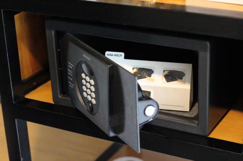 a nintendo wii game console in a microwave oven at The 108 Hotel in Islamabad
