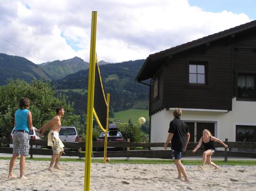 a group of people playing a game of volleyball at Gästehaus Hartweger in Haus im Ennstal
