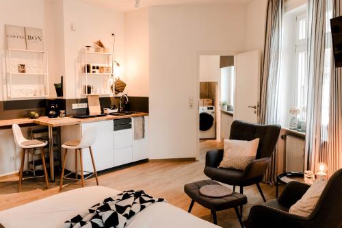 a room with a kitchen and a living room at Little Loft Limburg in Limburg an der Lahn