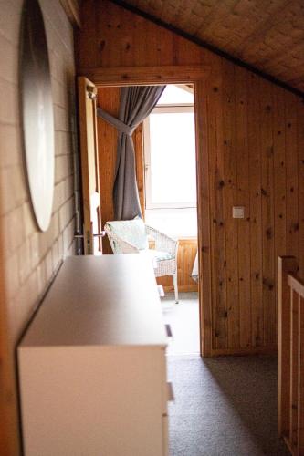 a kitchen with a counter and a door to a room at Hideaway Extertal in Extertal