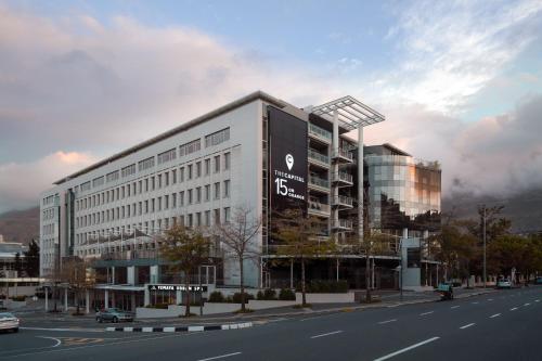 a building with a sign on the side of a street at The Capital 15 on Orange Hotel & Spa in Cape Town