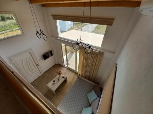 an overhead view of a bathroom with a sink and a window at KTIMA MORAITI - Seaside Houses in Katerini