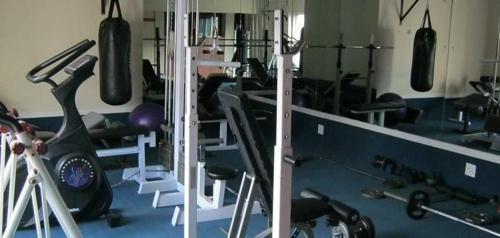 a gym with lots of exercise equipment in it at Hermanus Beach Club - Le Maree House 18 in Hermanus