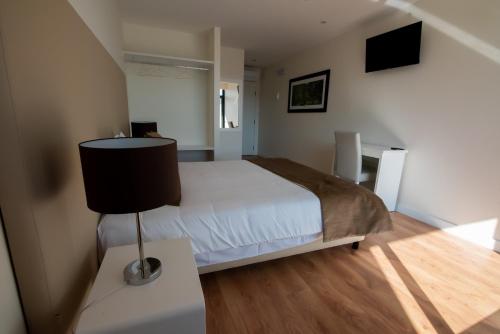 Ένα ή περισσότερα κρεβάτια σε δωμάτιο στο Hotel Quinta do Viso