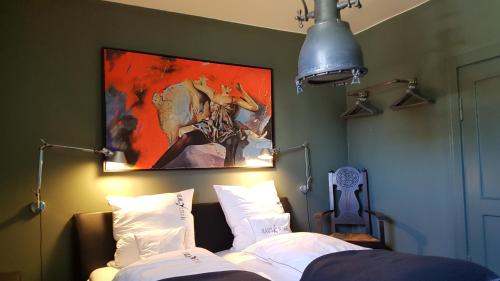 En eller flere senger på et rom på Haus Noge Sylt - Offizierhaus Design Appartments strandnah