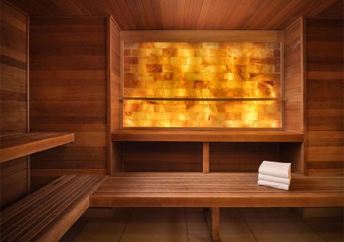 a sauna with a bench and a towel at Grand America Hotel in Salt Lake City