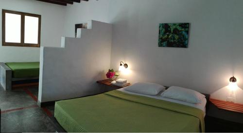 Un pat sau paturi într-o cameră la Posada Casa Las Trinitarias