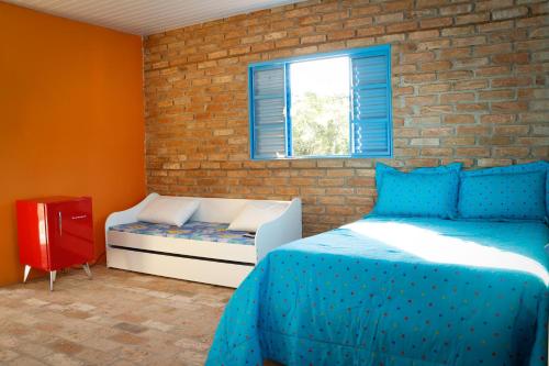سرير أو أسرّة في غرفة في Fortuna Casas de Campo