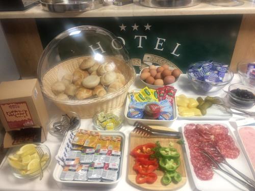 a refrigerator filled with lots of different types of food at Hotel Orient Zagreb in Zagreb