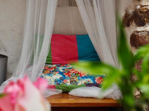 a bedroom with a bed with a canopy at Studio Camino Real in Saint-Jean-Pied-de-Port