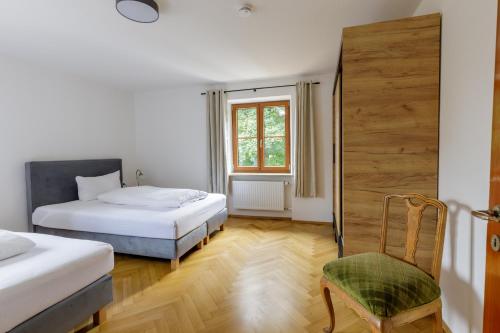 En eller flere senge i et værelse på Stadtvilla Falkenstein
