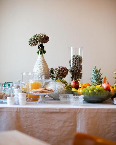 a table with fruits and vegetables on top of it at Hotel Panorama in Bertinoro