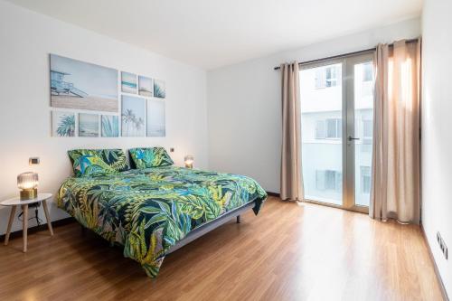 A bed or beds in a room at Flatguest Tabaiba 1