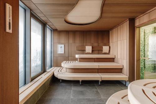 a sauna with four beds and a window at The Brucklyn Apartments in Erlangen