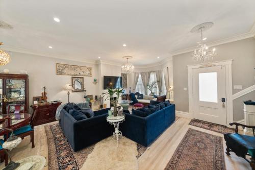 a living room with blue couches and a table at San Francisco Retreat Just Steps from Golden Gate Park and Ocean Beach! home in San Francisco
