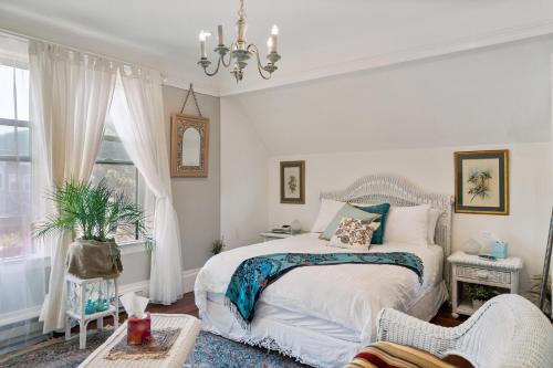 a bedroom with a bed and a chandelier at San Francisco Retreat Just Steps from Golden Gate Park and Ocean Beach! home in San Francisco