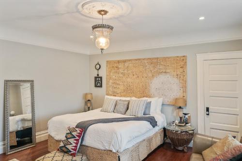 a bedroom with a large bed and a mirror at San Francisco Retreat Just Steps from Golden Gate Park and Ocean Beach! home in San Francisco