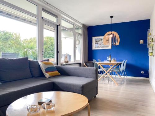 a living room with a couch and a table at Vakantie appartement Westkapelle WE05 in Westkapelle