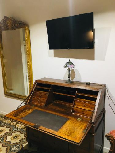 a large wooden box with a television on a wall at Antica dimora lamarmora in Cagliari