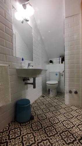 a bathroom with a sink and a toilet at El Patinillo ENCANTO in Cáceres