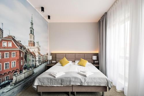 Postel nebo postele na pokoji v ubytování Meet Poznań Hotel