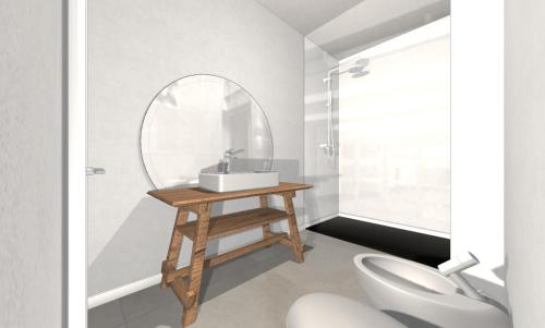 bagno con lavandino e specchio di App 204 Palazzo Cavour a Bolzano