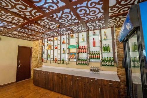 a liquor store with a display of alcohol bottles at Hotel TamilNadu, Hosur in Hosūr