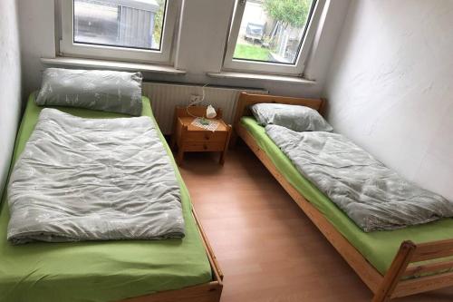 Ein Bett oder Betten in einem Zimmer der Unterkunft Ahmed Al-Hamadani