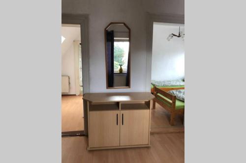 a bathroom with a sink and a mirror at Ahmed Al-Hamadani in Verden