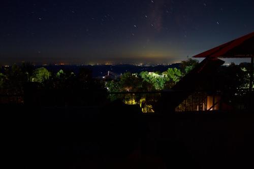 a starry night with a view of the city at Samskara & Samsara in Lansdowne