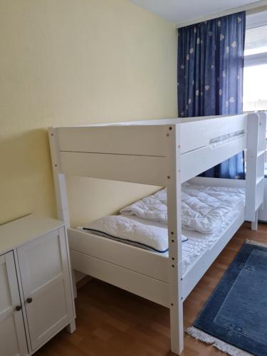 a white bunk bed in a room at Vier Jahreszeiten 3 37 in Großenbrode