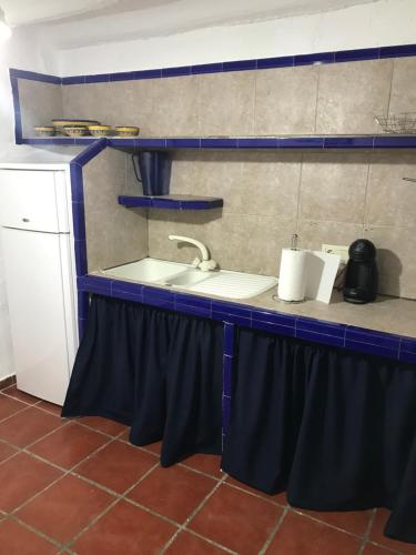 a kitchen with a sink and a counter top at Azahar in Lecrin
