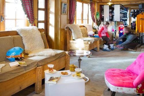 a room with couches and chairs in a store at le A by neige et roc in Morzine