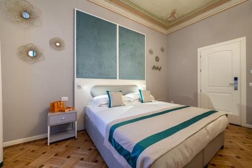 a bedroom with a large bed and a window at Hotel Monte Rosa in Chiavari