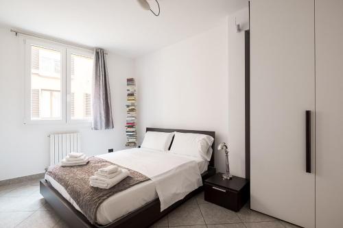 Postel nebo postele na pokoji v ubytování Sotto i portici di Via Pietralata by Wonderful Italy