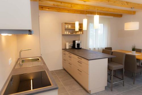 a kitchen with a sink and a counter top at Ferienhaus Schilcherland in Hochneuberg