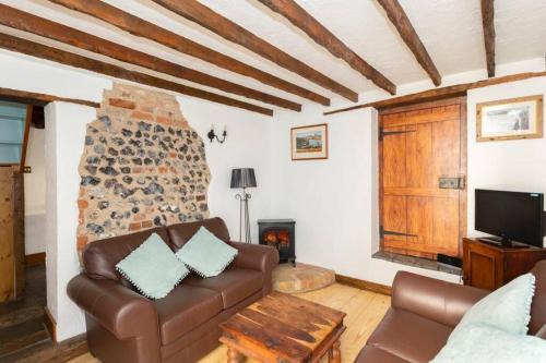 a living room with a couch and a fireplace at Barnaby's Lodge in Broadstairs - Exclusive unmissable deals! Book now before it's too late! in Broadstairs