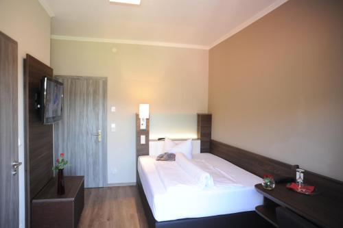 Katil atau katil-katil dalam bilik di Sporthotel Bernrieder Hof GmbH