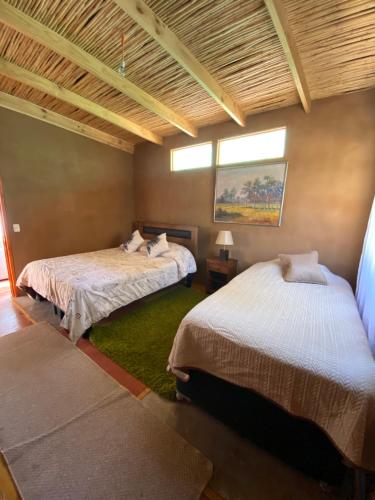 מיטה או מיטות בחדר ב-La Inclusiva de Cochiguaz